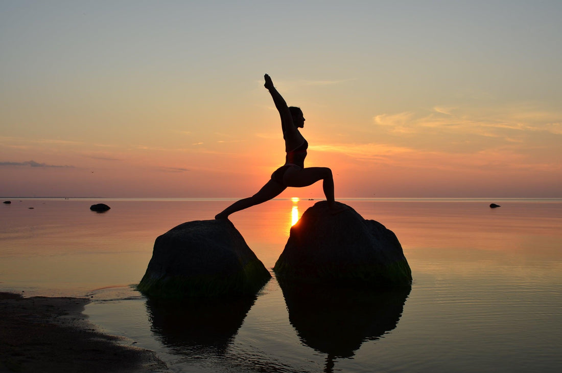 beach-yoga-on-rocks-at-sunset