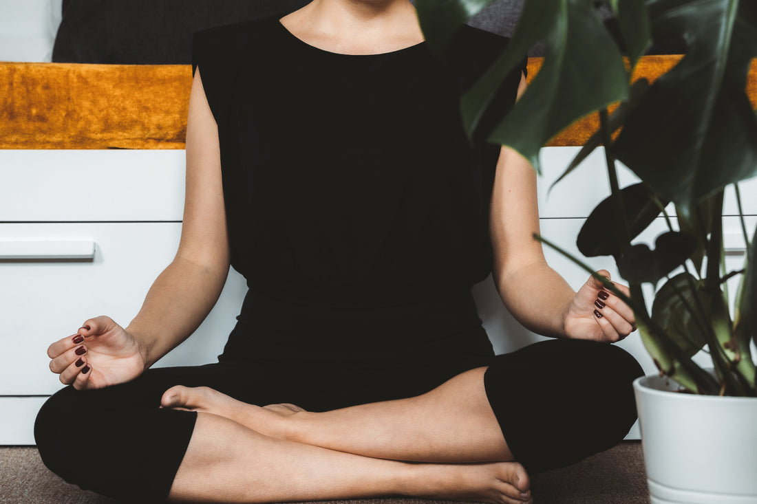 person-sits-in-a-calm-meditation-pose