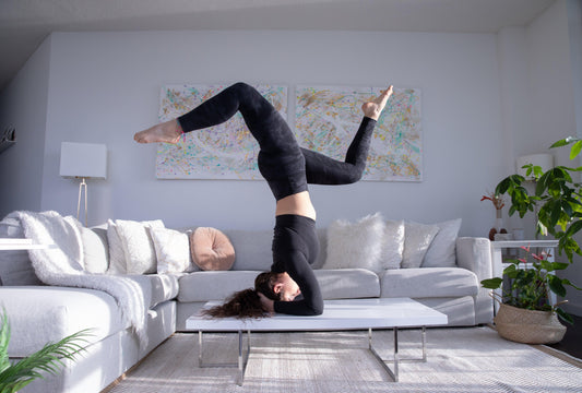 practicing-yoga-on-their-living-room-table