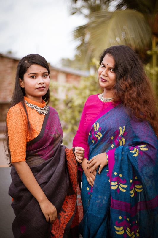 two-woman-stand-outside-and-pose-for-the-camera