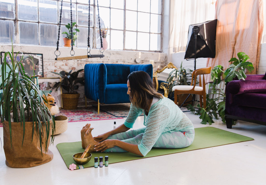 woman-siting-on-green-yoga-mat-in-the-living-room