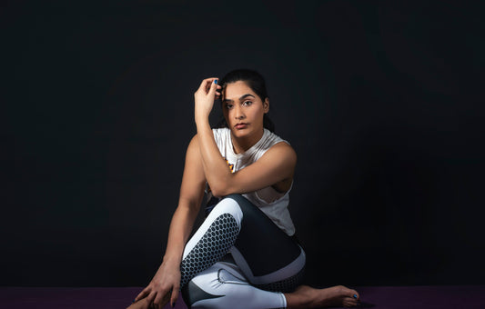 woman-makin-yoga-pose-in-dark-room